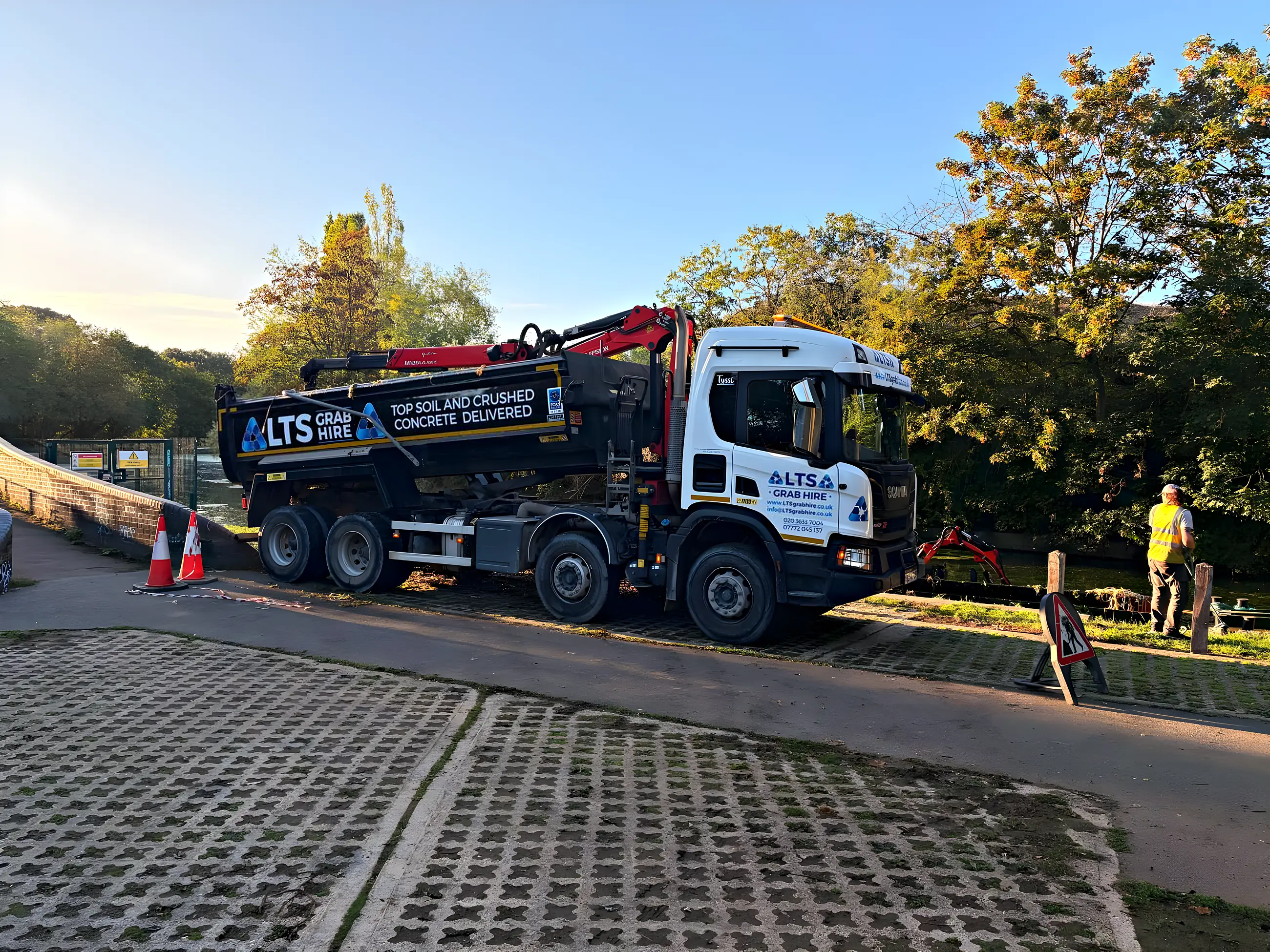 The side of the eight-wheeler: top soil and crushed concrete delivered