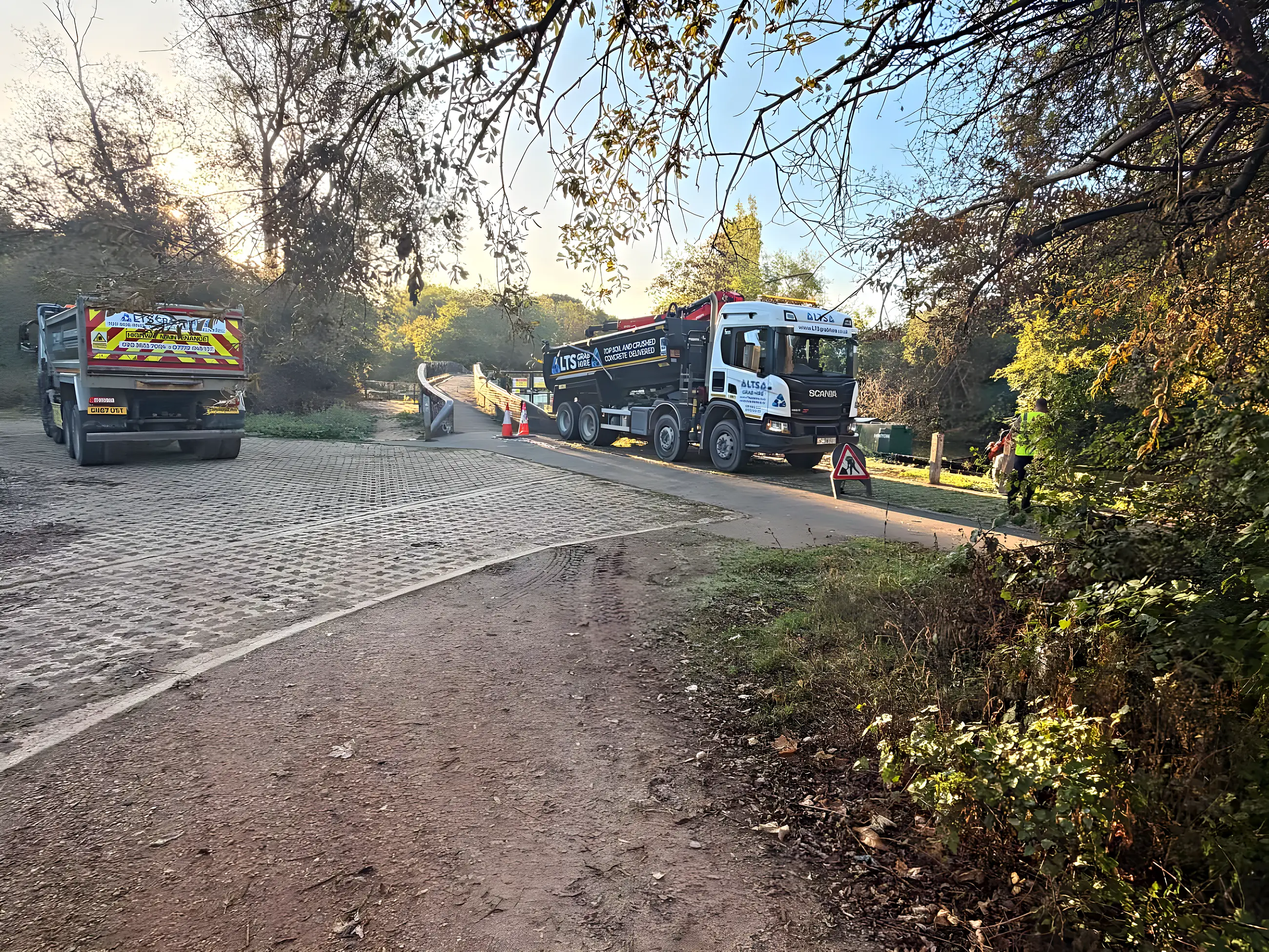 Two of our lorries on the same riverside job