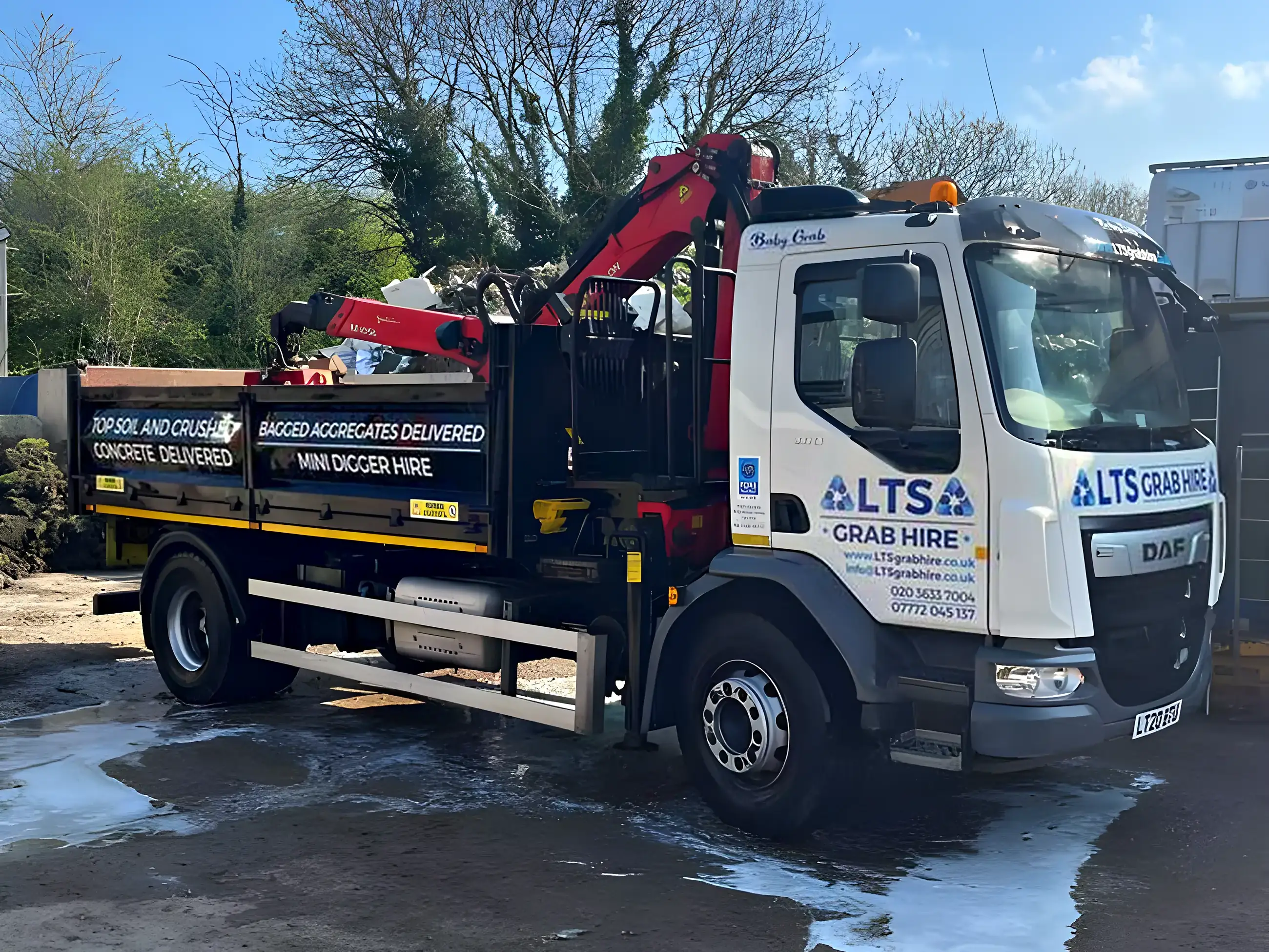 The four-wheel mini grab lorry, loaded and ready to leave the yard