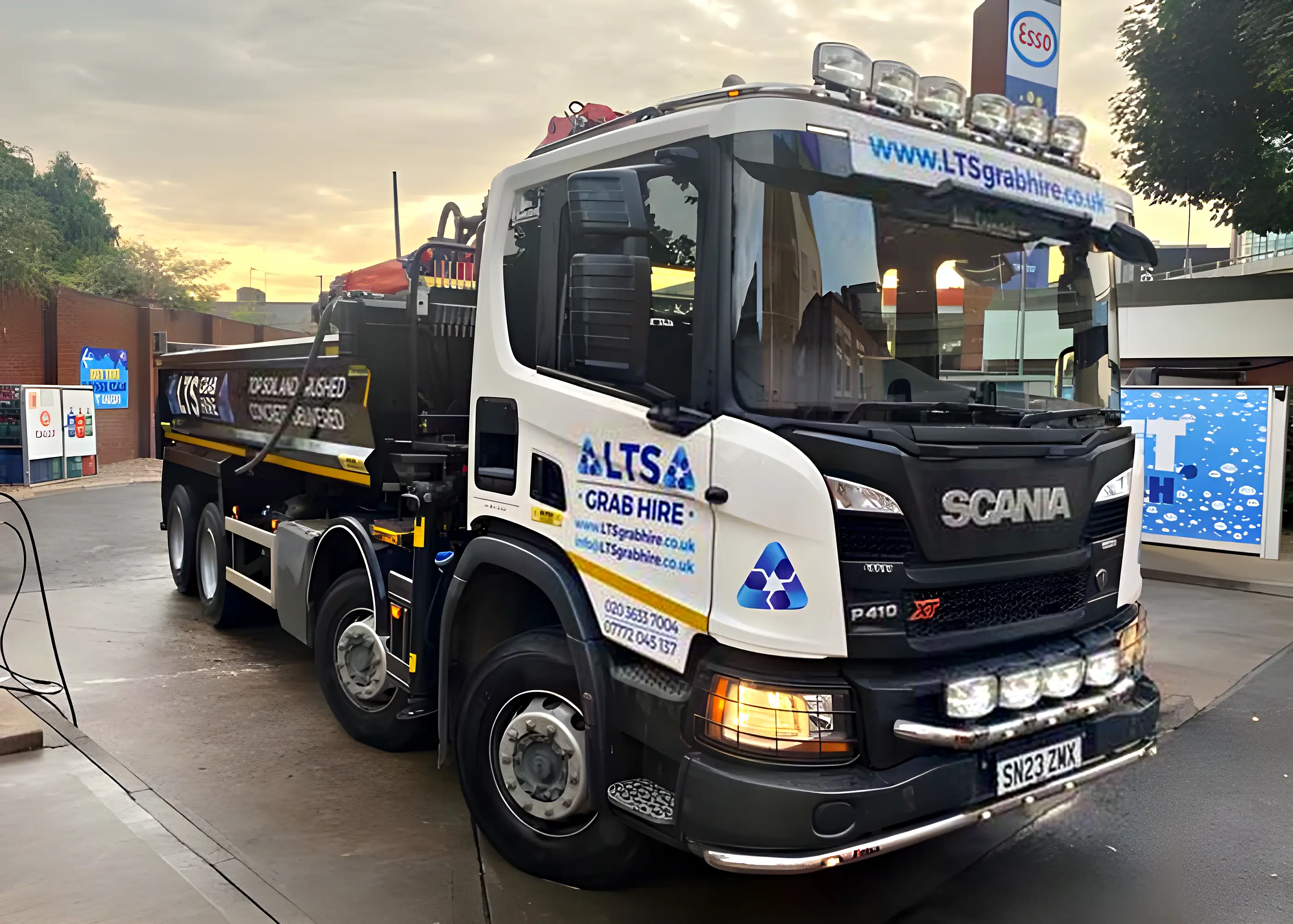 A grab lorry at the yard at sunset