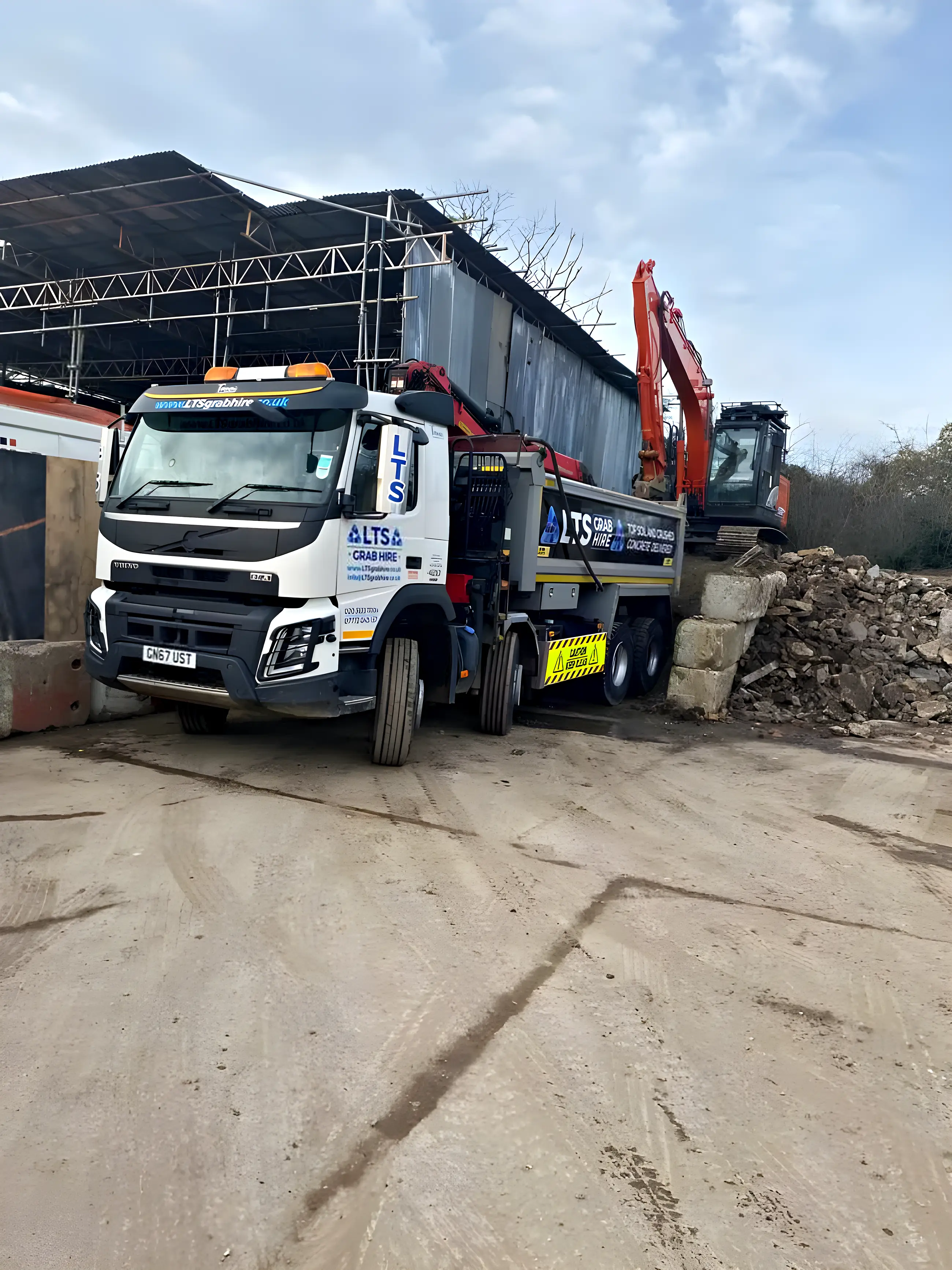 A grab lorry parked outside a house on a residential street